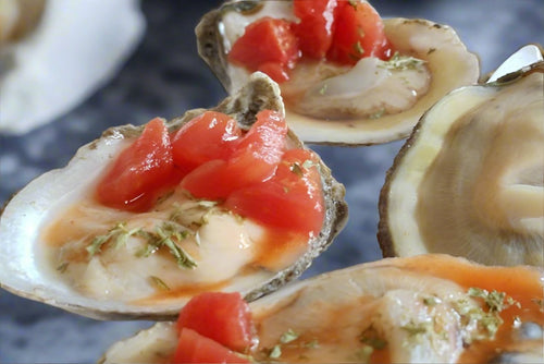 Oysters with tomatoes and spices